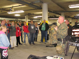 An officer gives a demonstration to a crowd